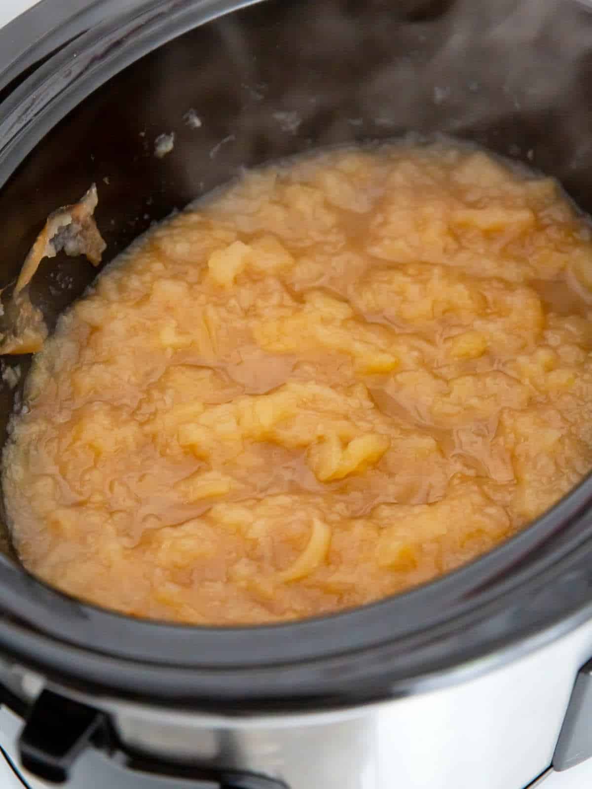cooked apples turning to the mushy, sauce stage with no sugar and no spices.