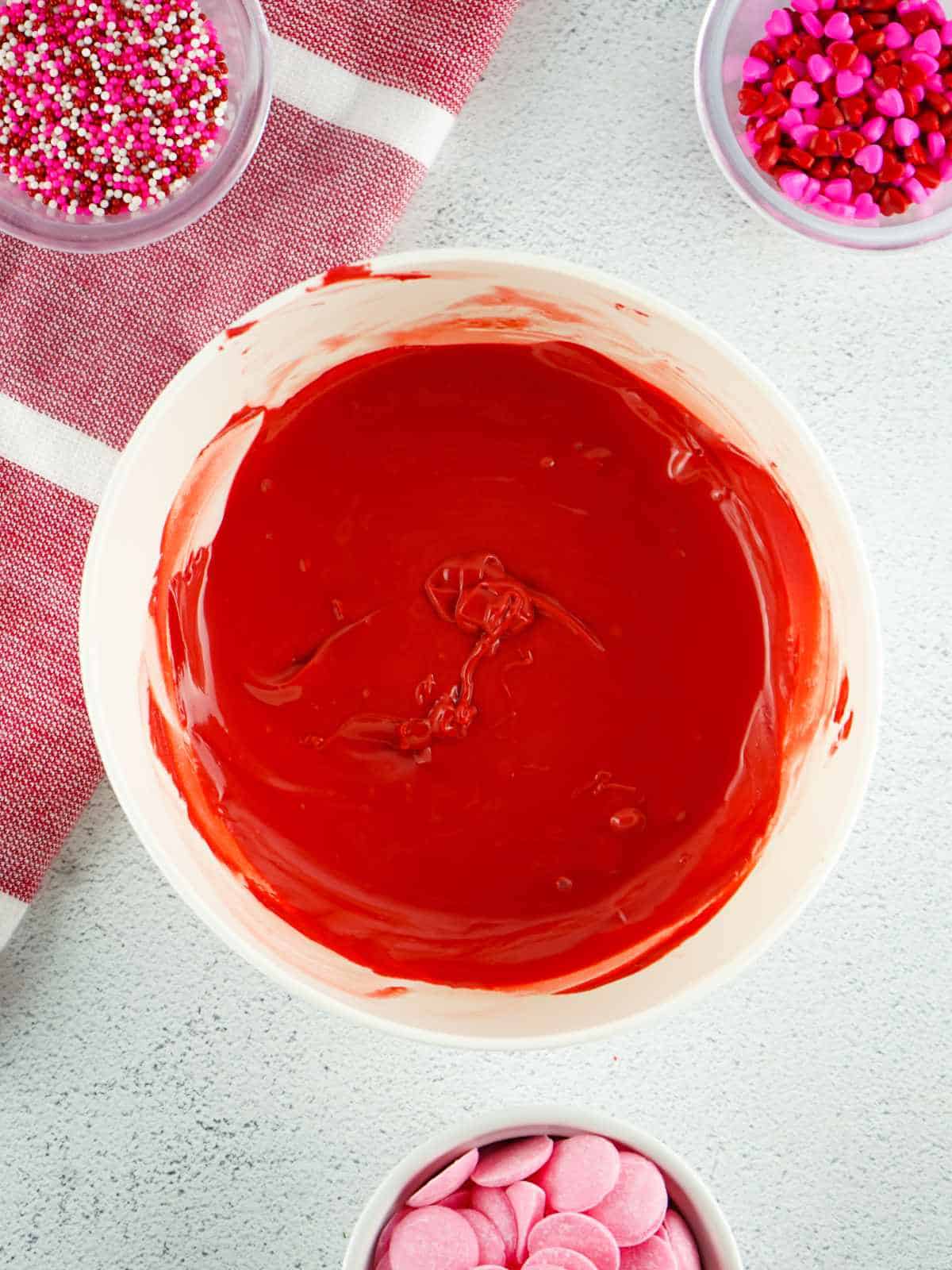 melted red candy melts in a bowl.