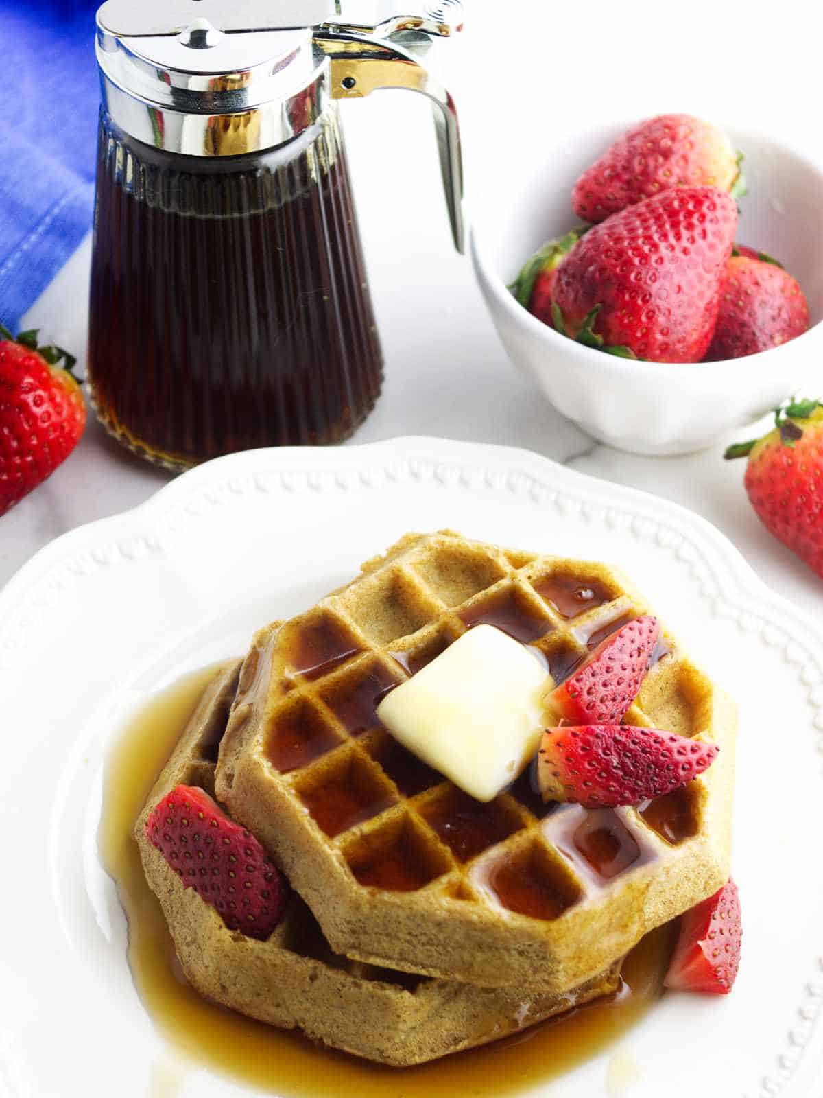 buttered waffles with maple syrup.