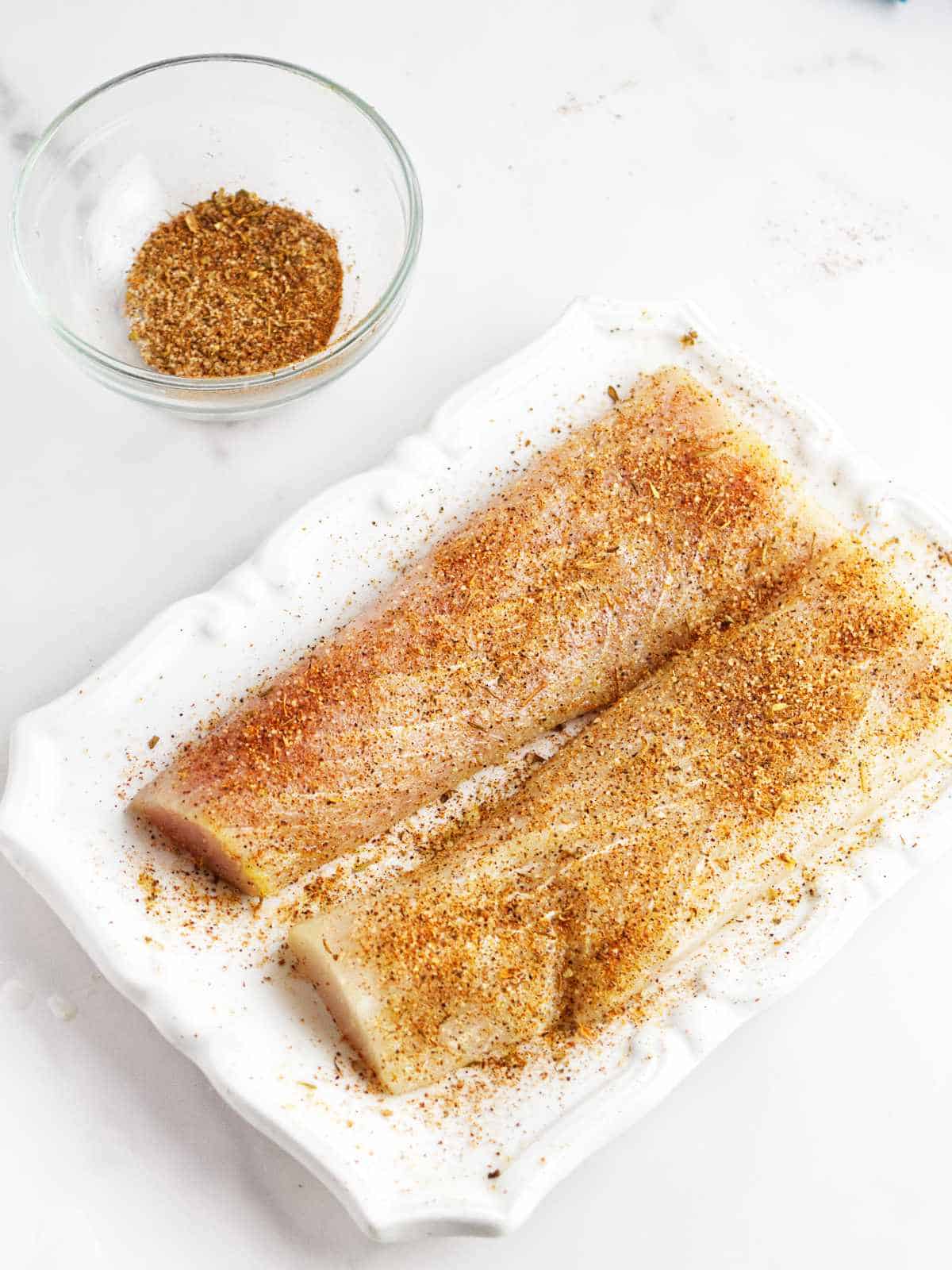 fish fillets with blackening spice sprinkled on.