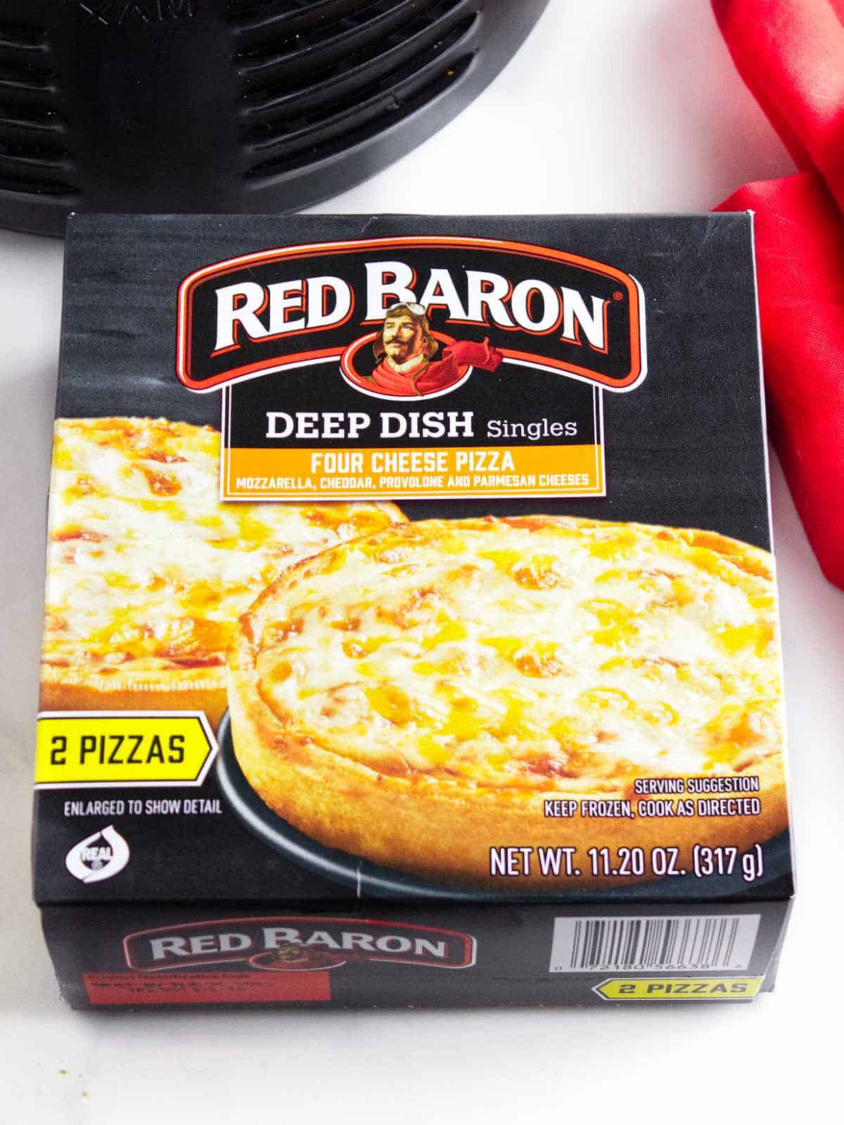 Red Baron deep dish frozen pizza singles in original box.