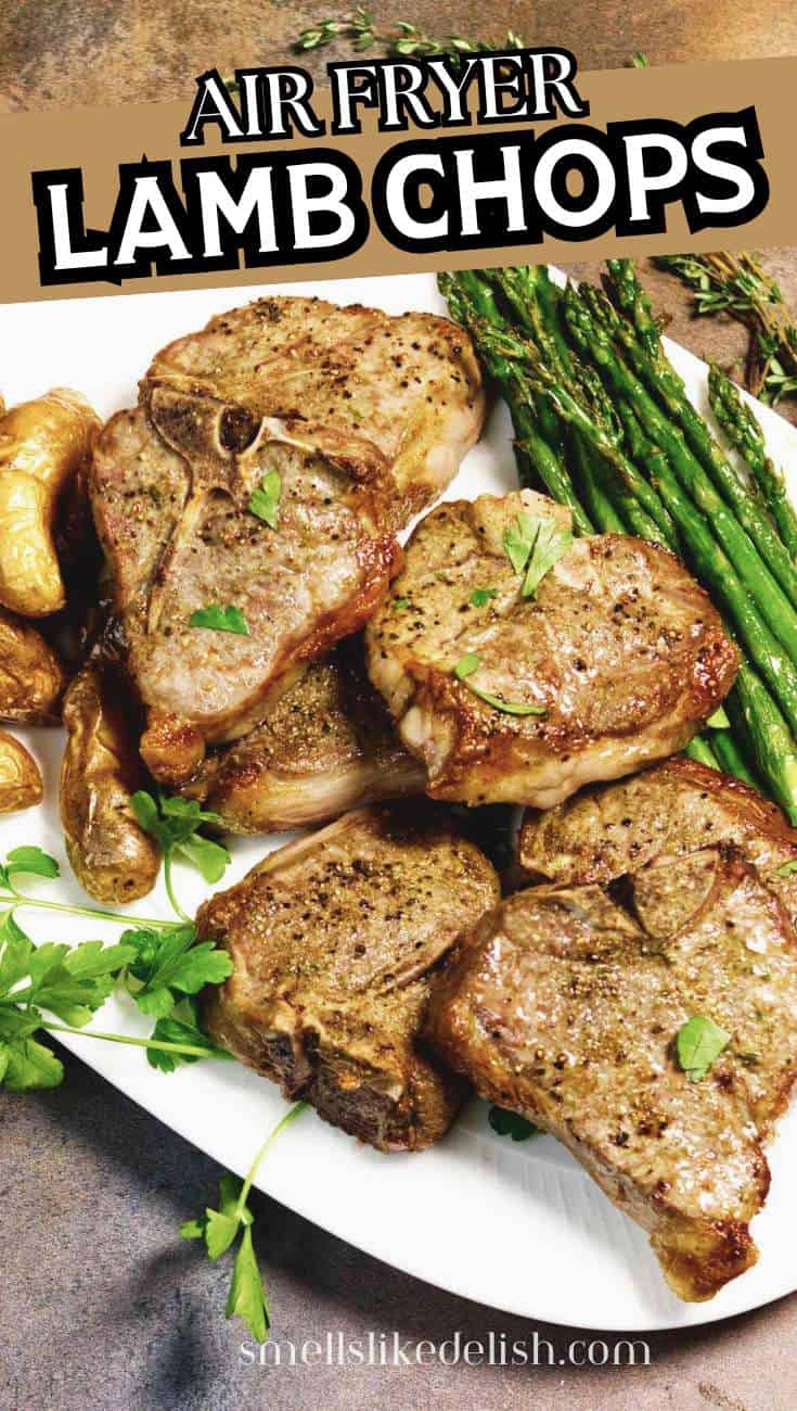 Air fryer lamb chops served with roasted potatoes and asparagus on a white plate.