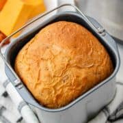 golden brown bread machine cheese bread in the baking pan.