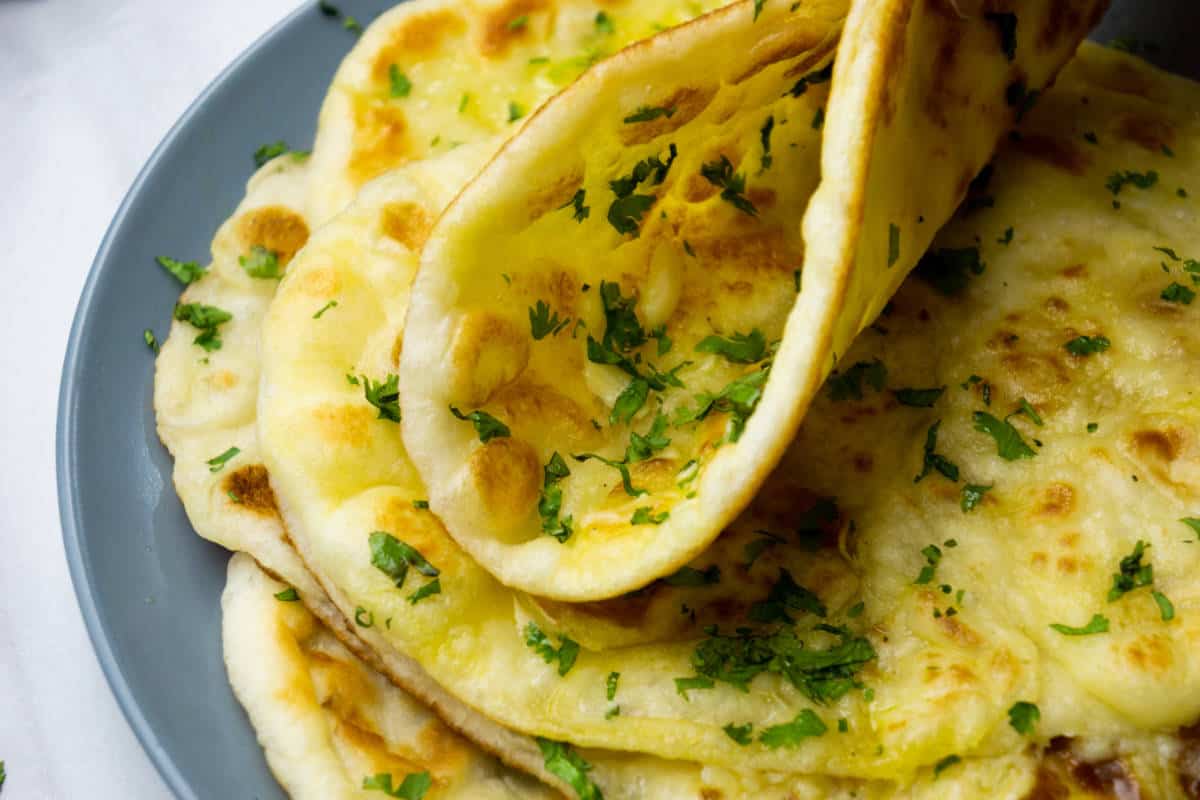 melted garlic butter and parsley on fresh made naan bread.