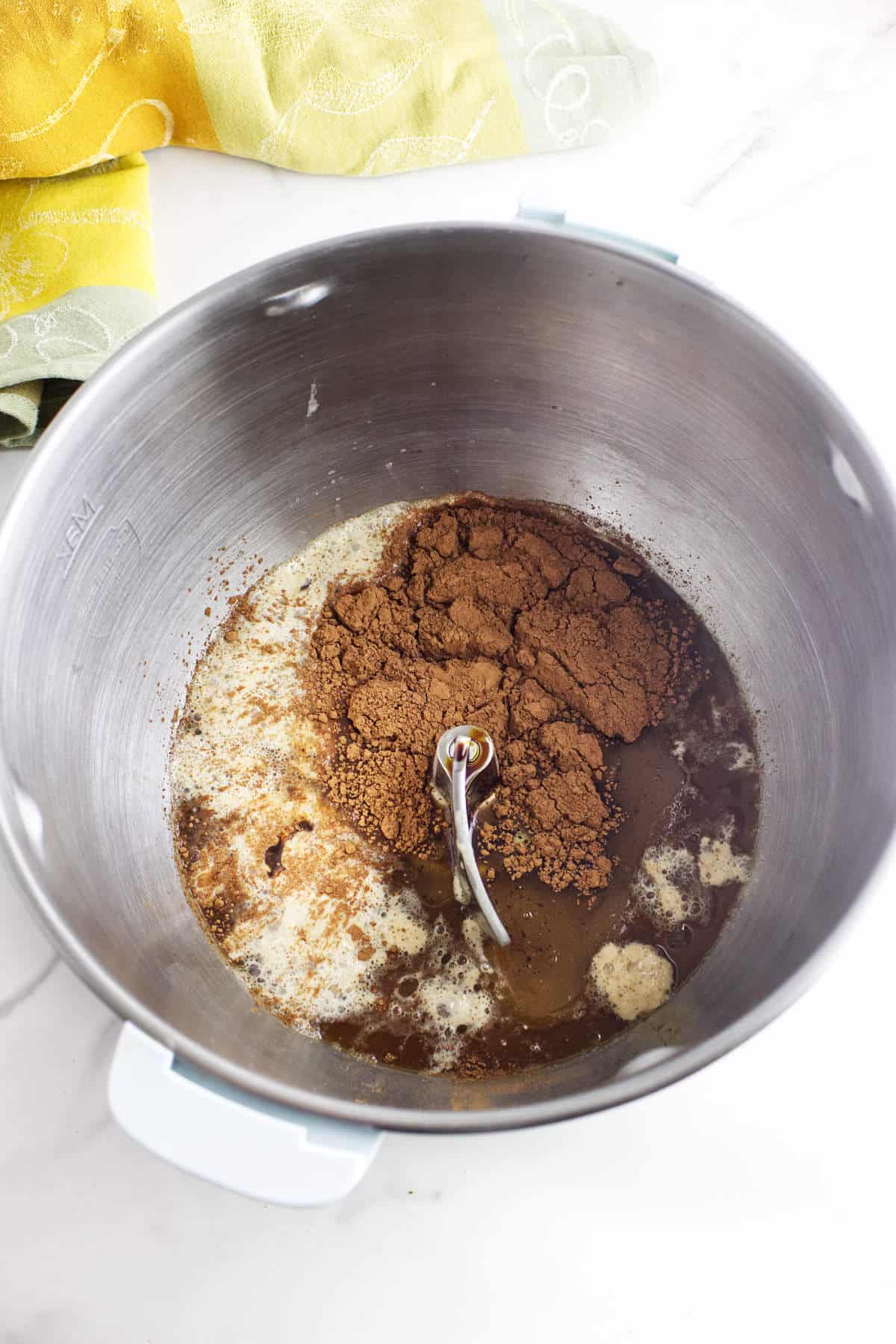 Cocoa powder added to wet ingredients for Cheesecake Factory brown bread rolls.