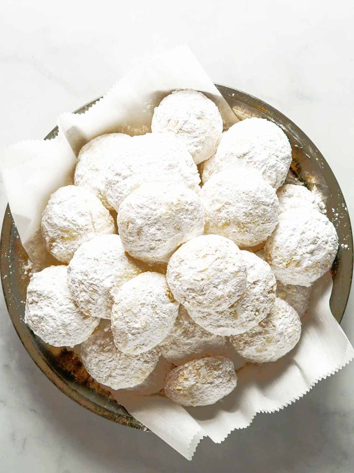 Danish wedding cookies rolled in powdered sugar.