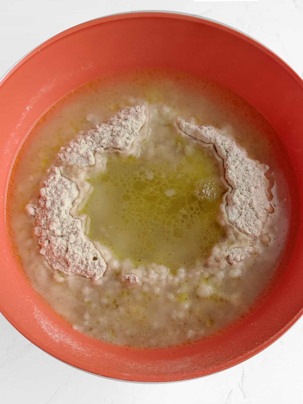 Hot water and oil added to flour for tortilla dough.