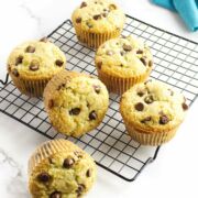 jumbo gluten-free chocolate chip muffins on a cooling rack.