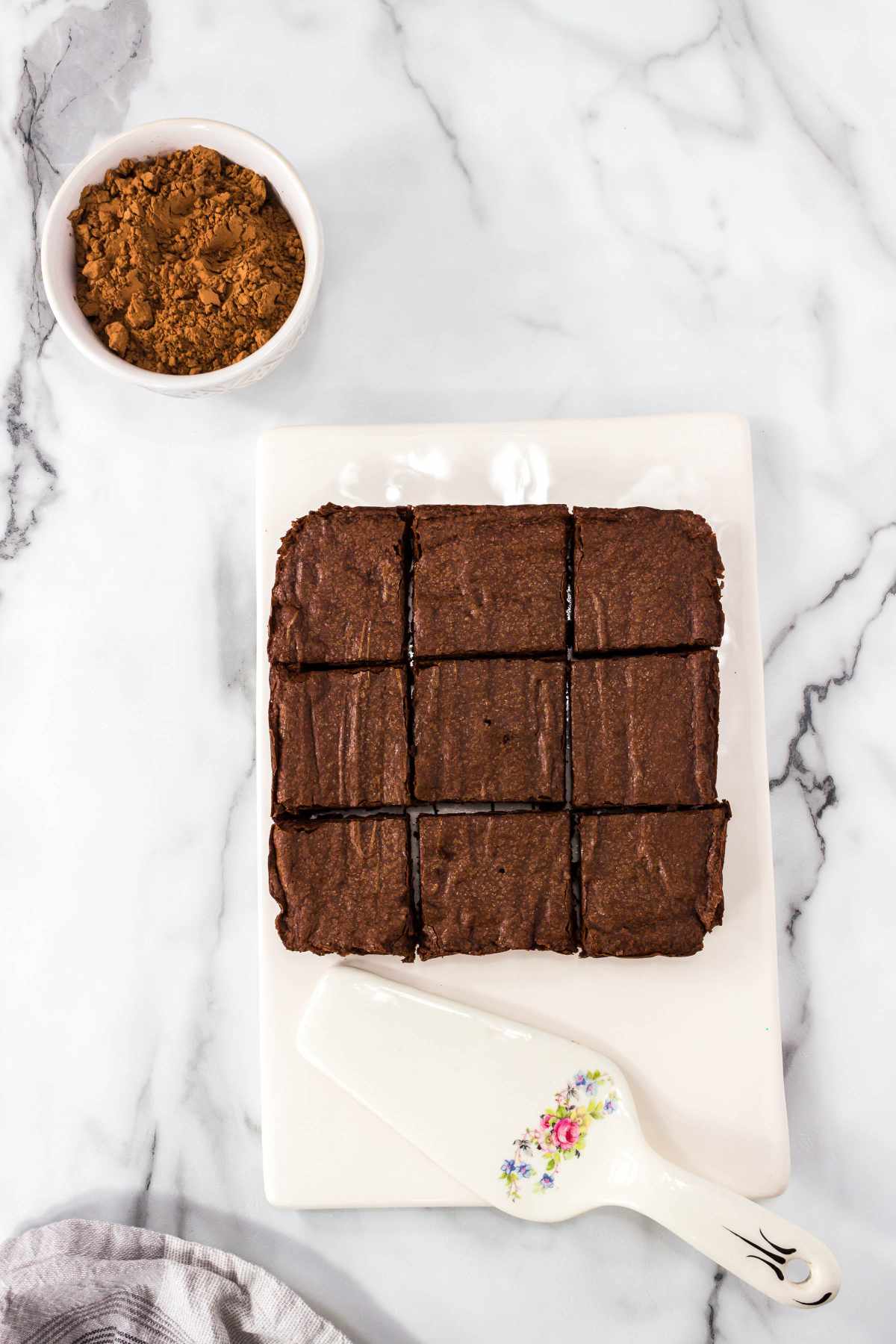 cooled slab of brownies cut into nine bars.