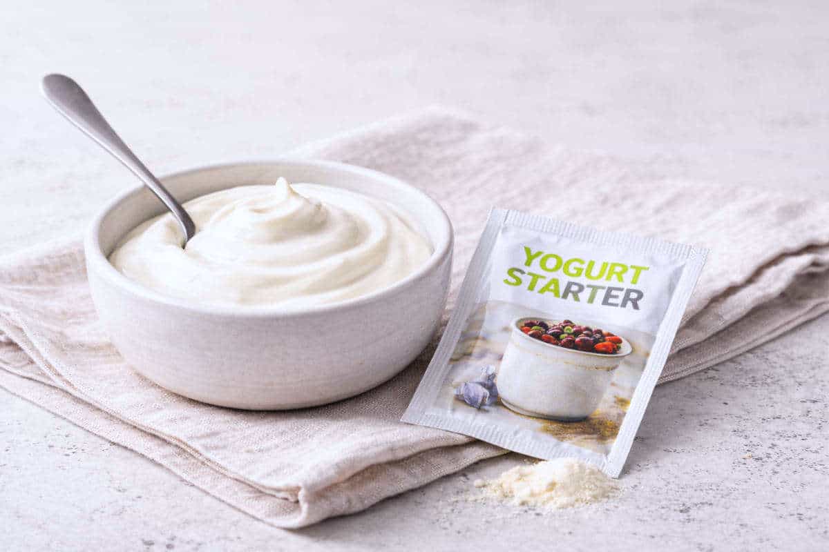 A packet of Yogurt Starter and a small glass bowl.