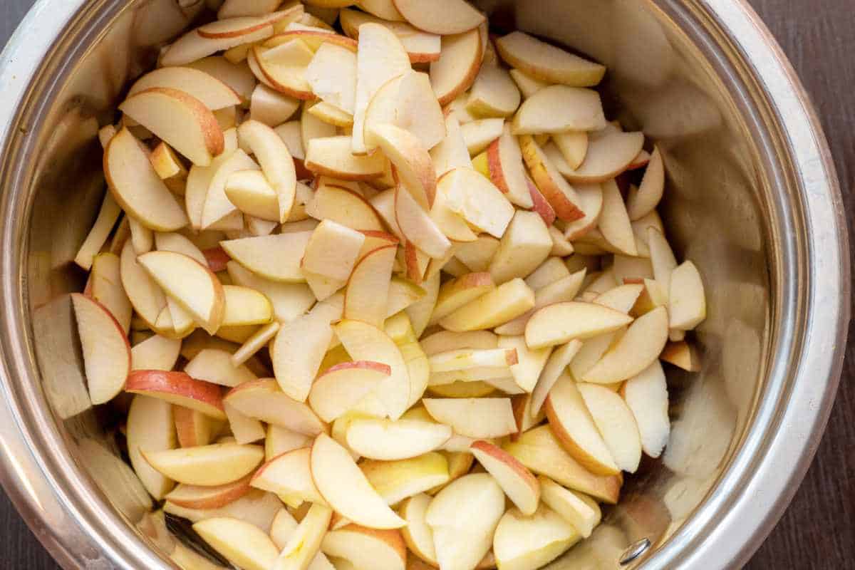 sliced apples in an mixing bowl.