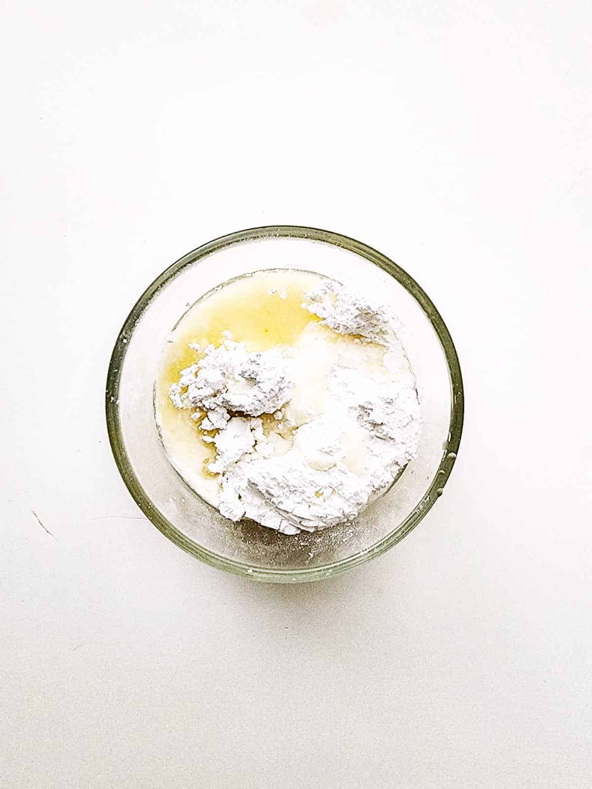 powdered sugar and lemon juice in a bowl for icing.