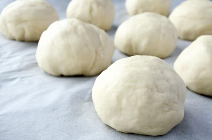 Divided dough balls resting before shaping bolillos.