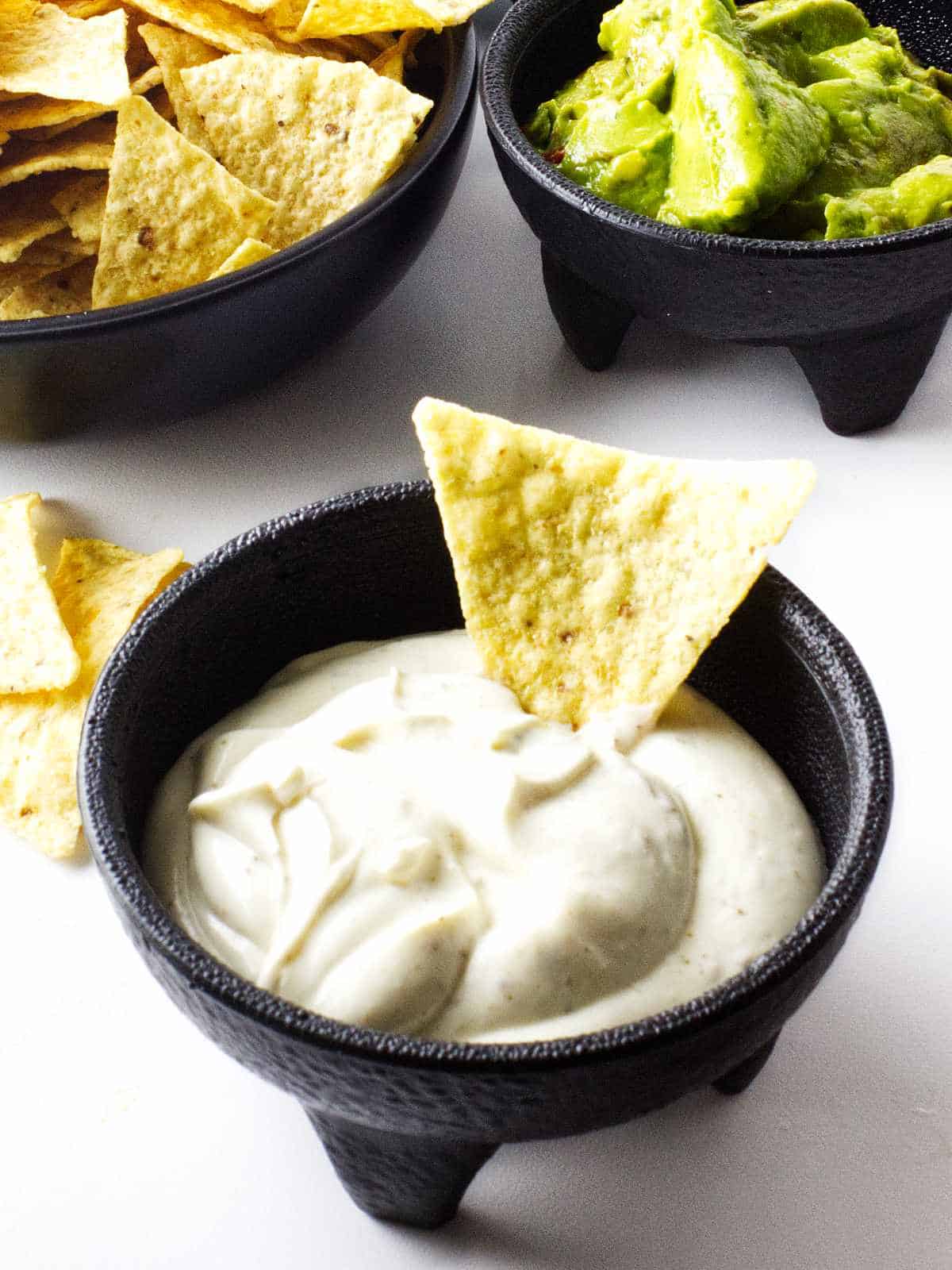 chips and dips in small bowls.