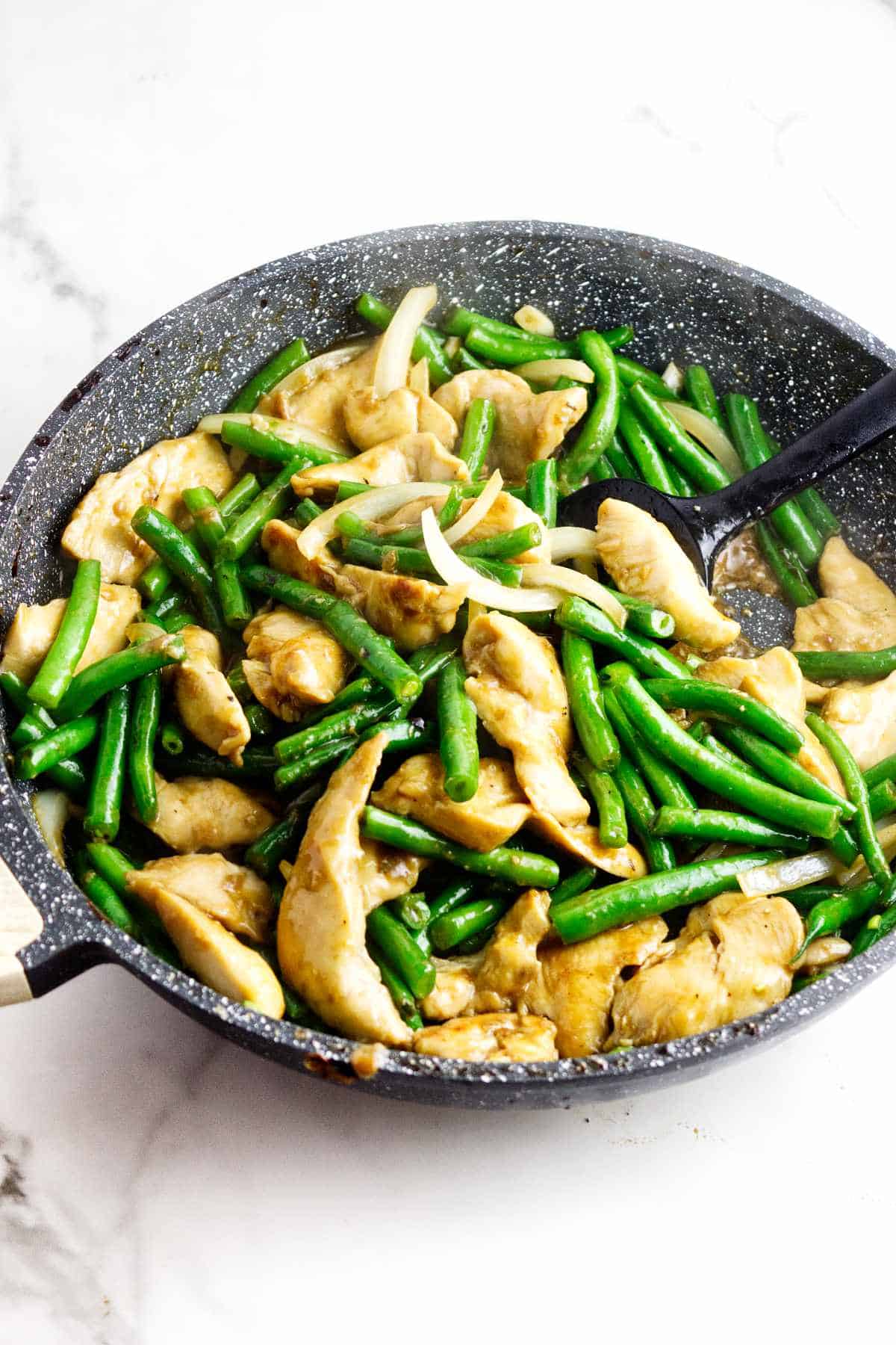 Panda Express String Bean Chicken copycat with tender chicken, green beans, and onion in ginger soy sauce.