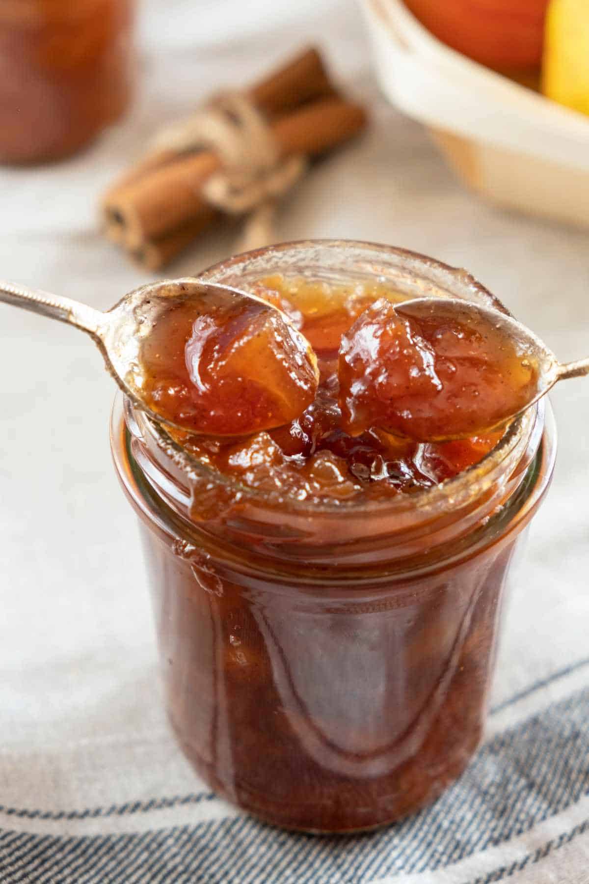 round canning jars of savory peach compote.