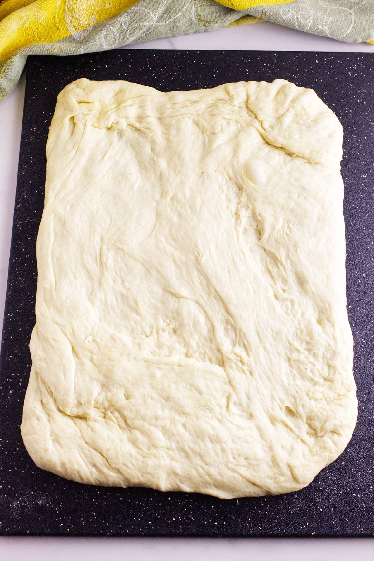 Dough rolled into a rectangle for shaping.