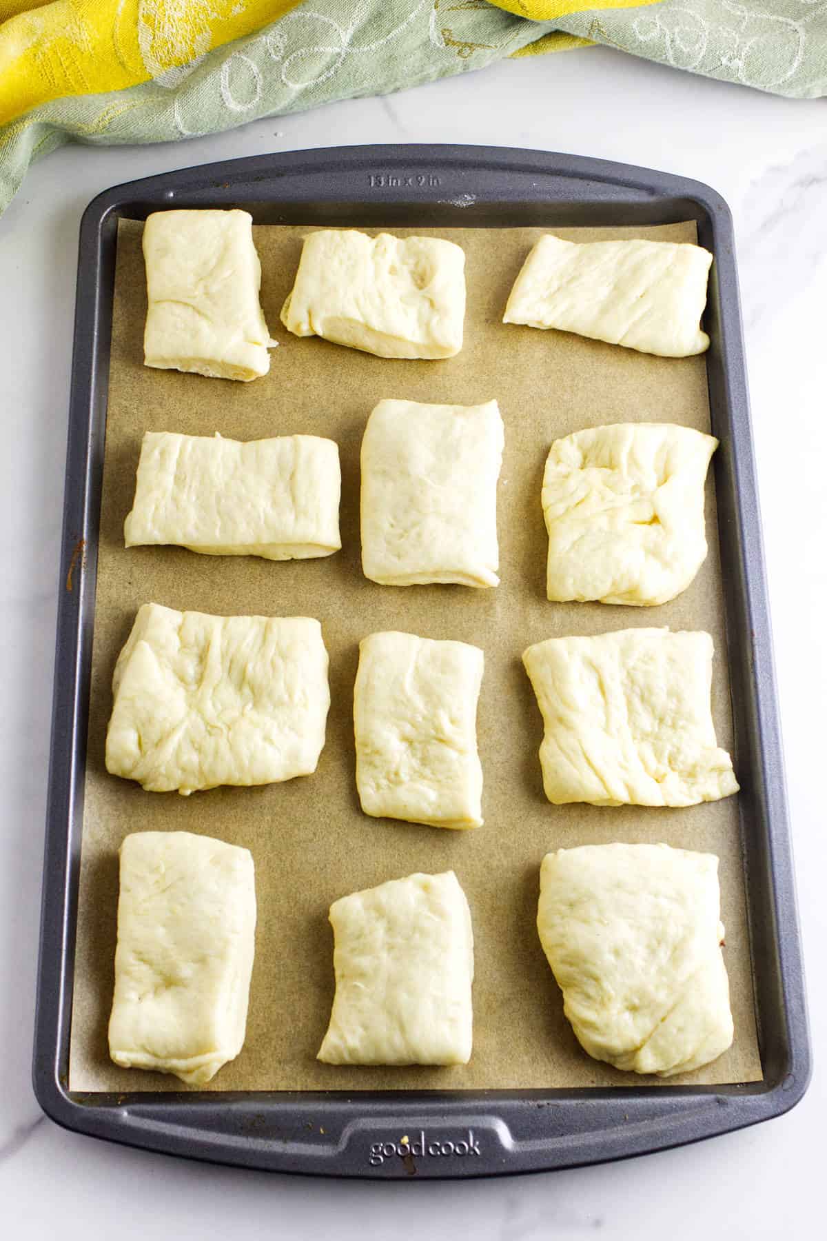Dough cut into evenly sized square portions.