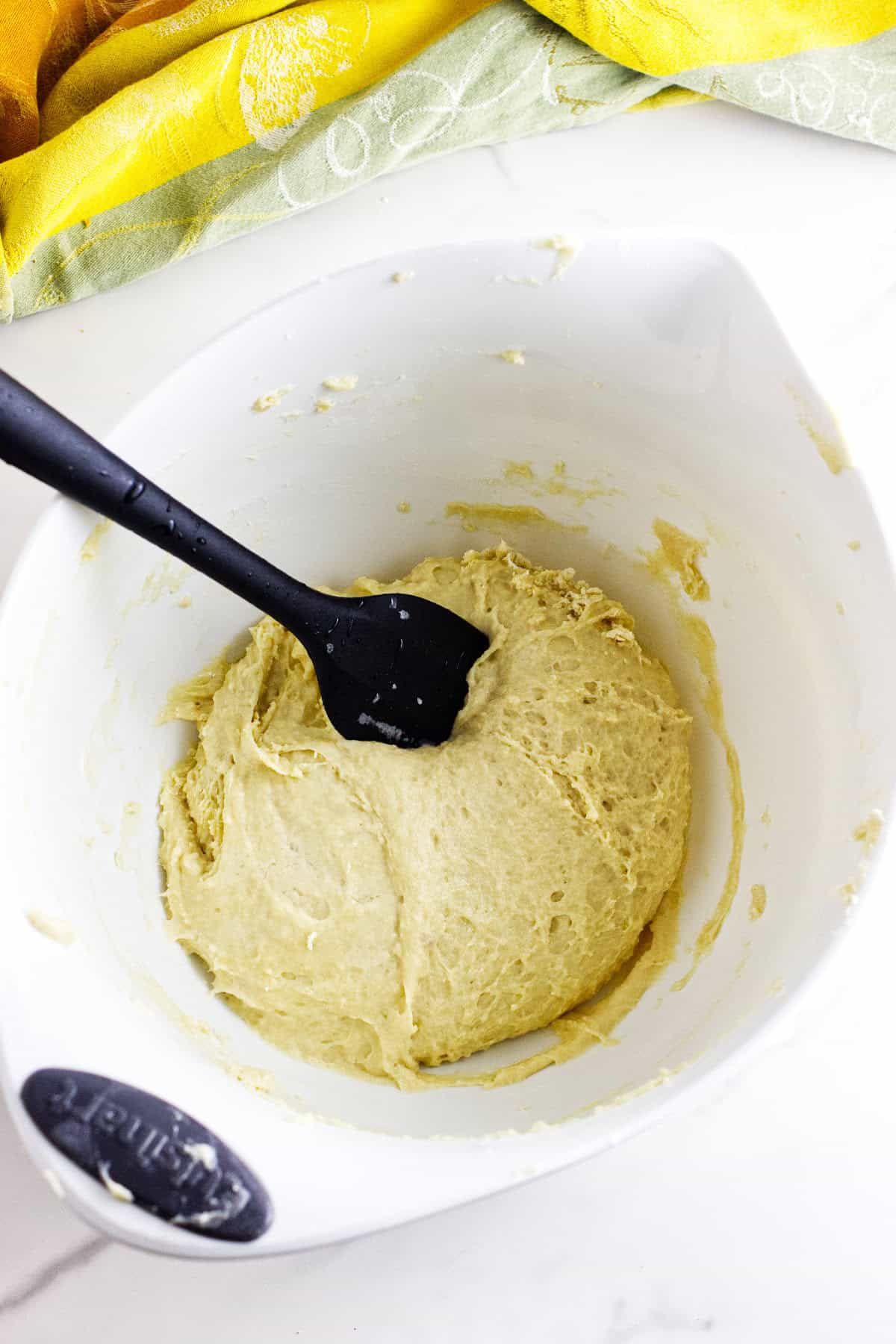 Soft dough coming together after adding flour.