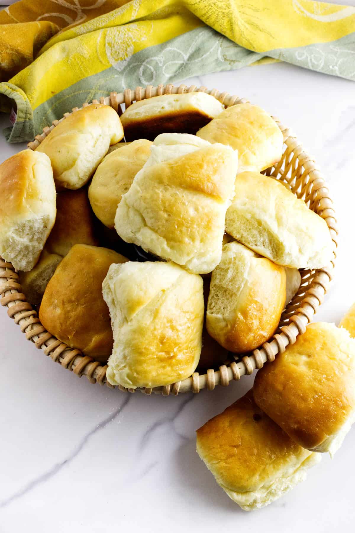 Freshly baked rolls brushed with melted butter.