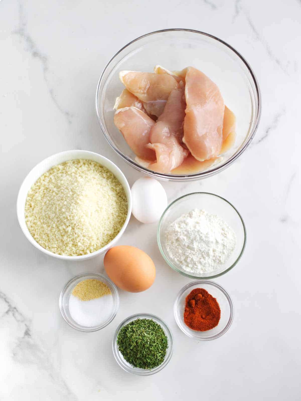 ingredients for making chicken cutlets with panko crumbs.