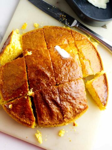 cut air fryer cornbread with melting butter on top.