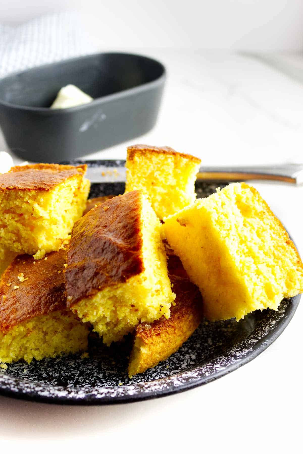 plate of stacked cut cornbread.