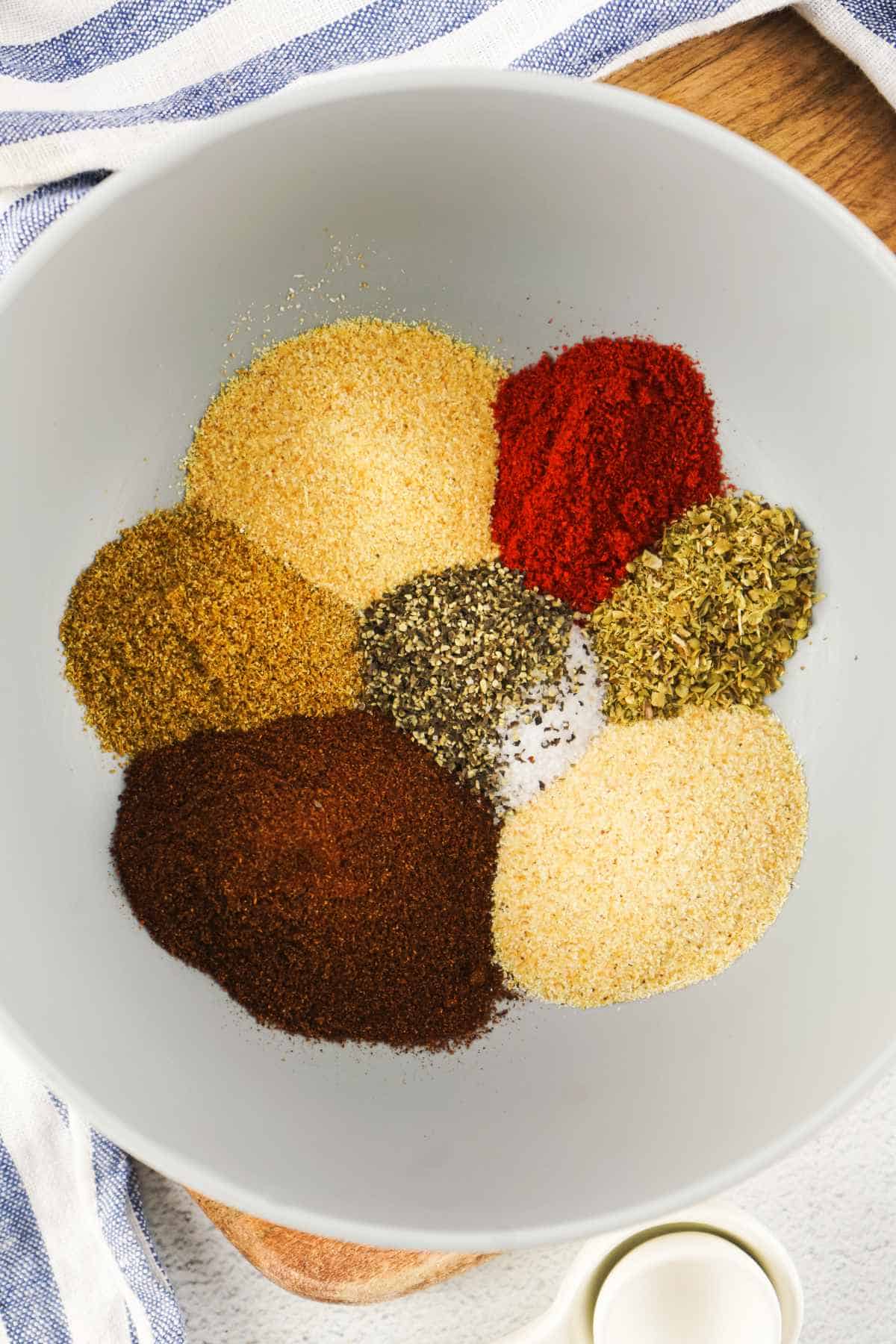 assortment of spices in a white bowl.