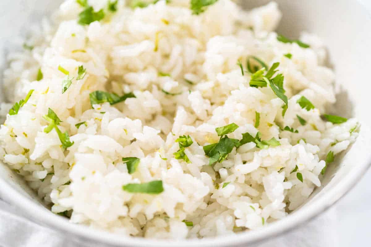 bowl of mixed cooked white rice, chopped cilantro, and lime zest.