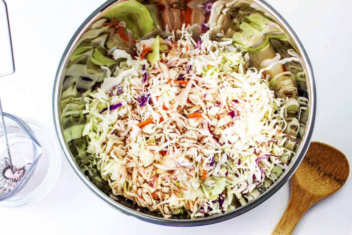 bowl of coleslaw ready to be tossed.
