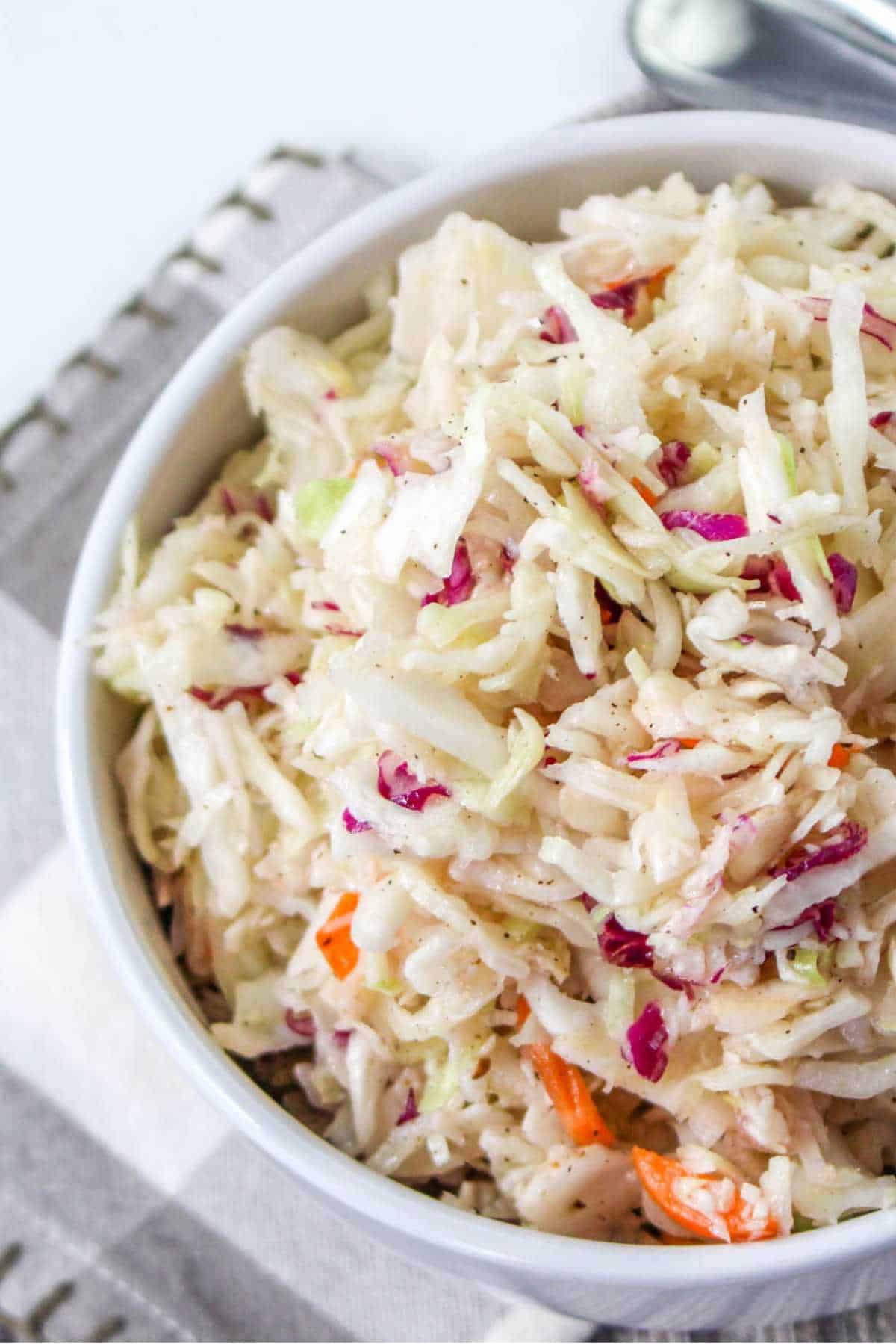 serving bowl of no mayonnaise coleslaw, Amish style.
