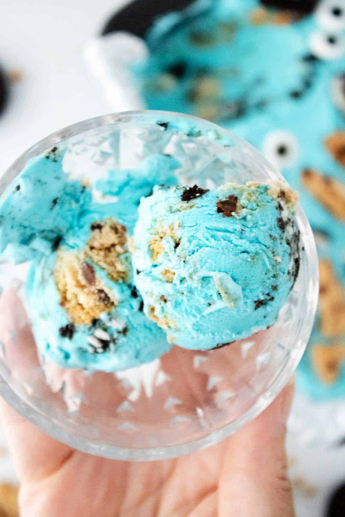scoop of cookie monster ice cream in a parfait bowl.