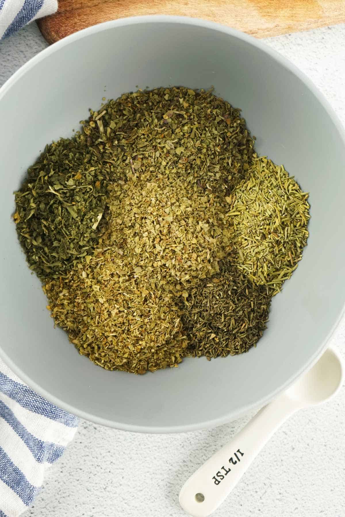 blending herbs in a bowl.