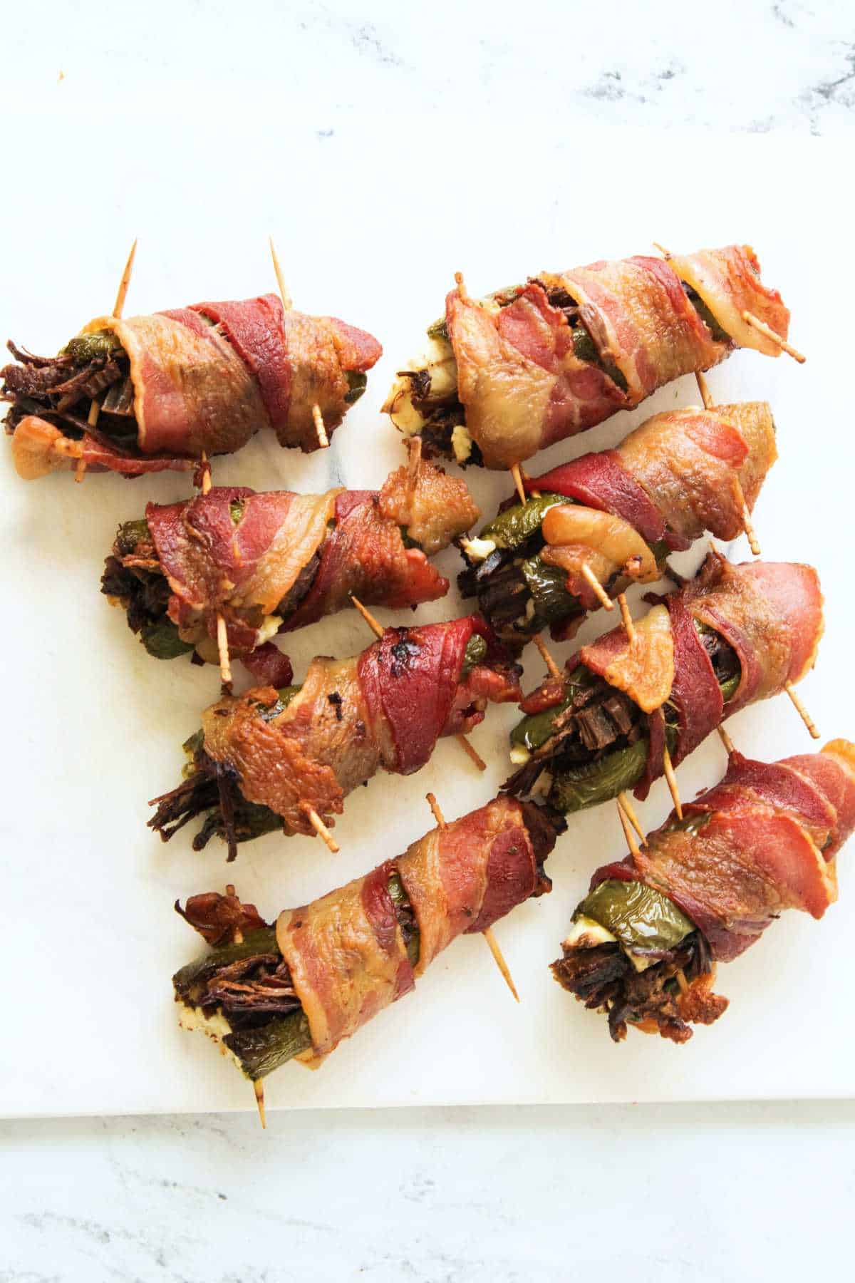 crisp bacon wrapped smoked stuffed jalapeno peppers.