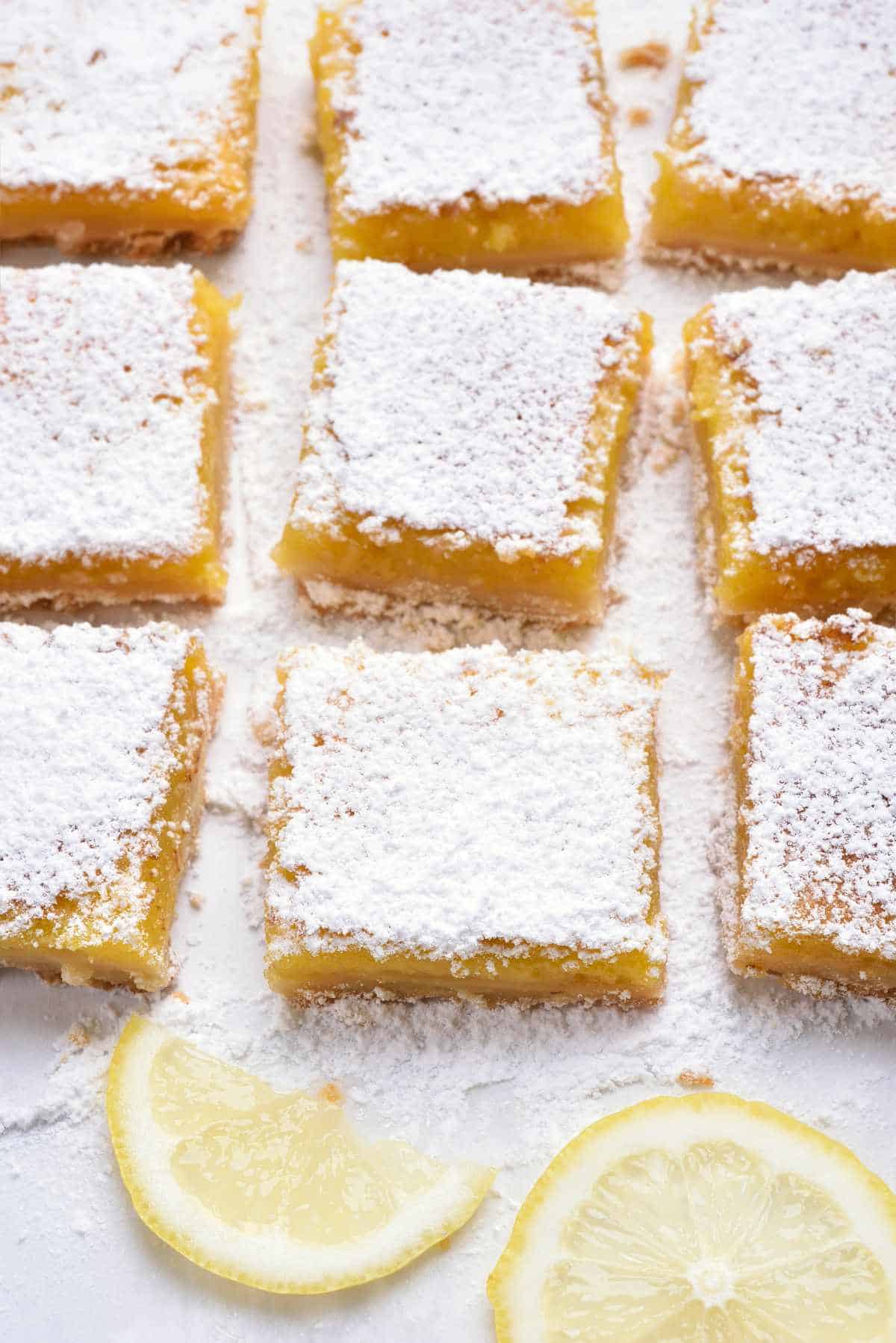 powdered sugar covered meyer squares on white parchment.