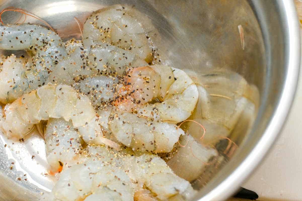 shrimp in a bowl with seasonings.