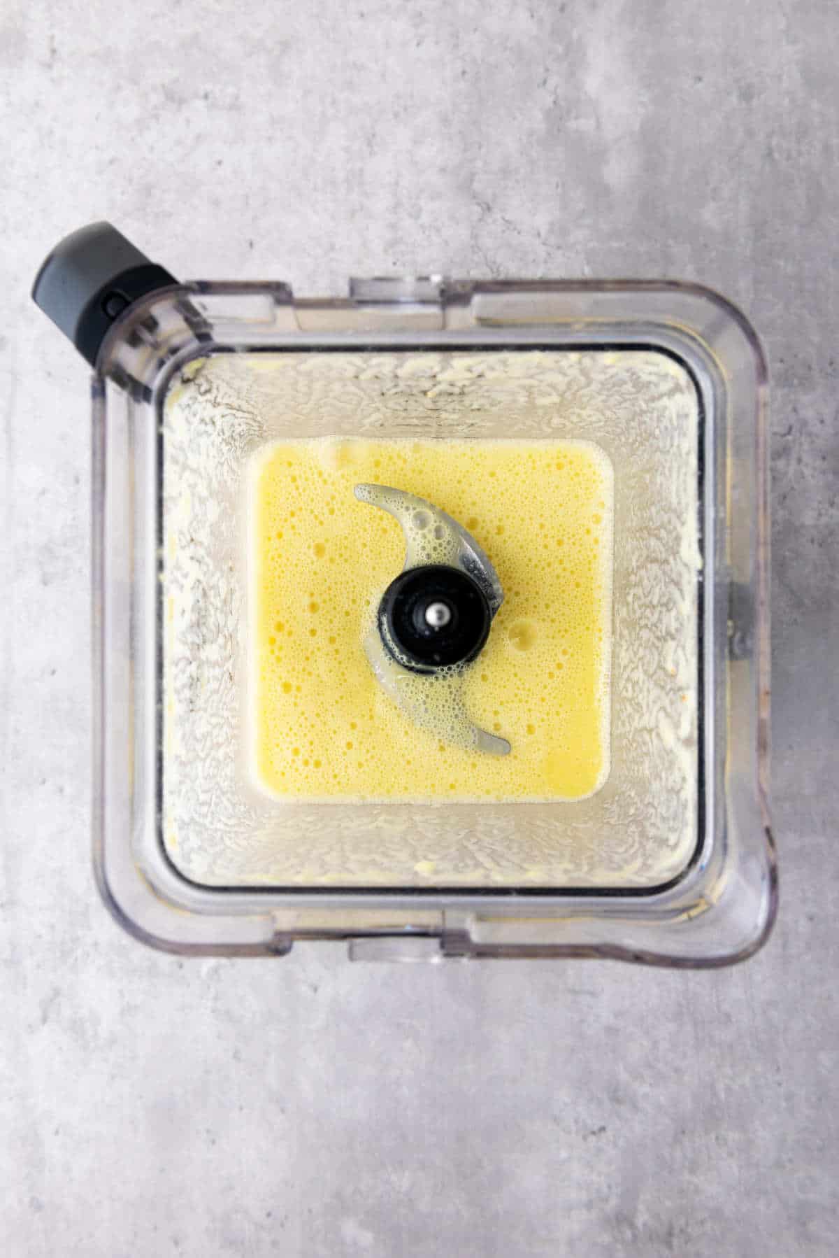 pureed pineapple in a blender.