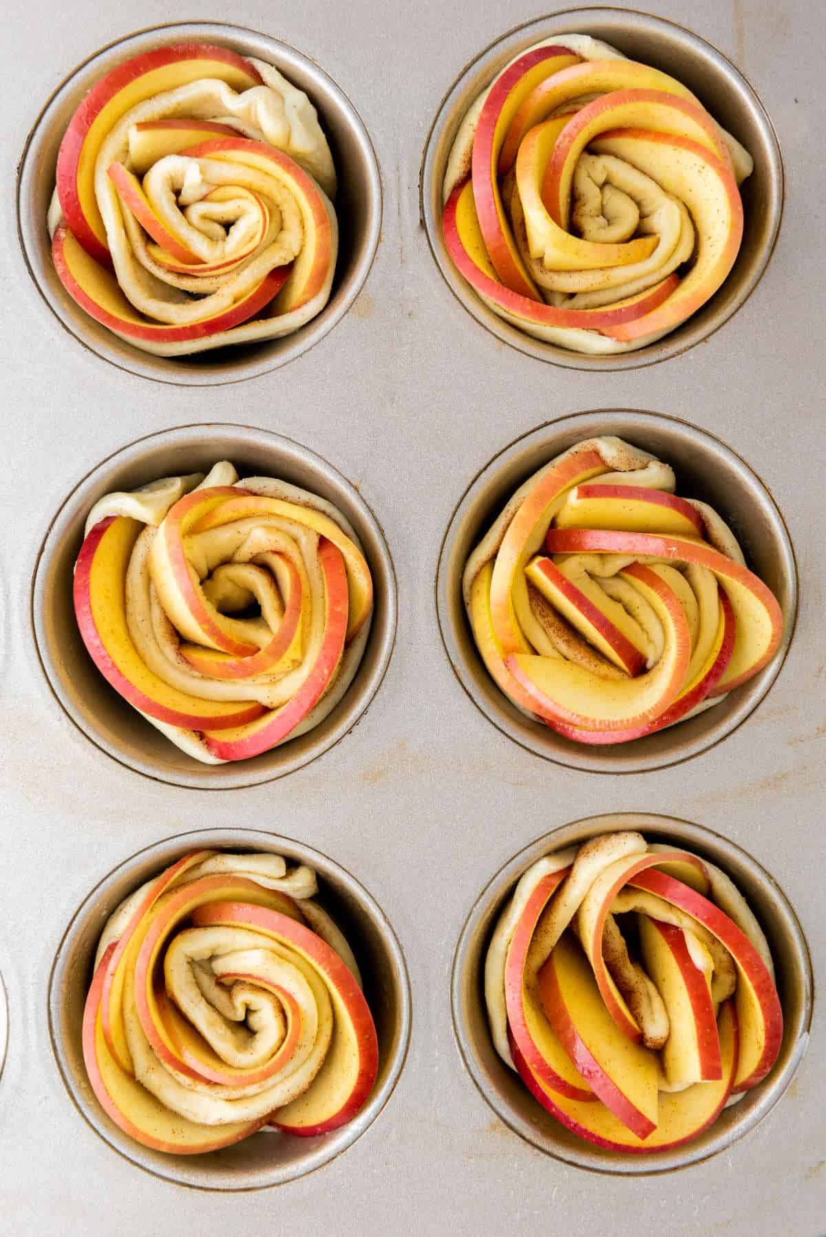 rosettes placed into cavities of a muffin pan.