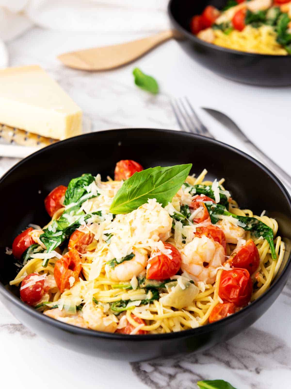 shrimp scampi angel hair tossed with cream sauce, shrimp, tomatoes, and spinach.
