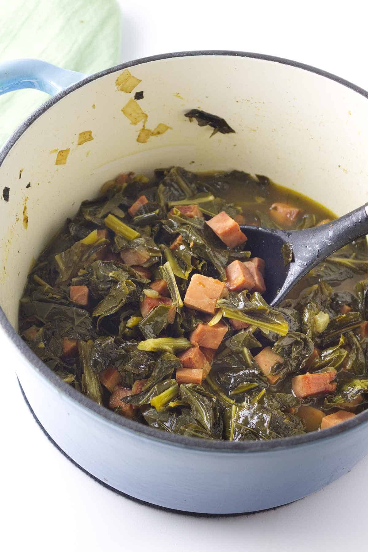  greens and ham in a pot.