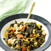 slow cooked ham and collards in a bowl.