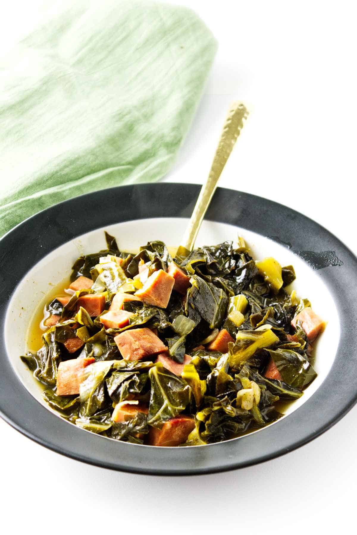 slow cooked ham and collards in a bowl.