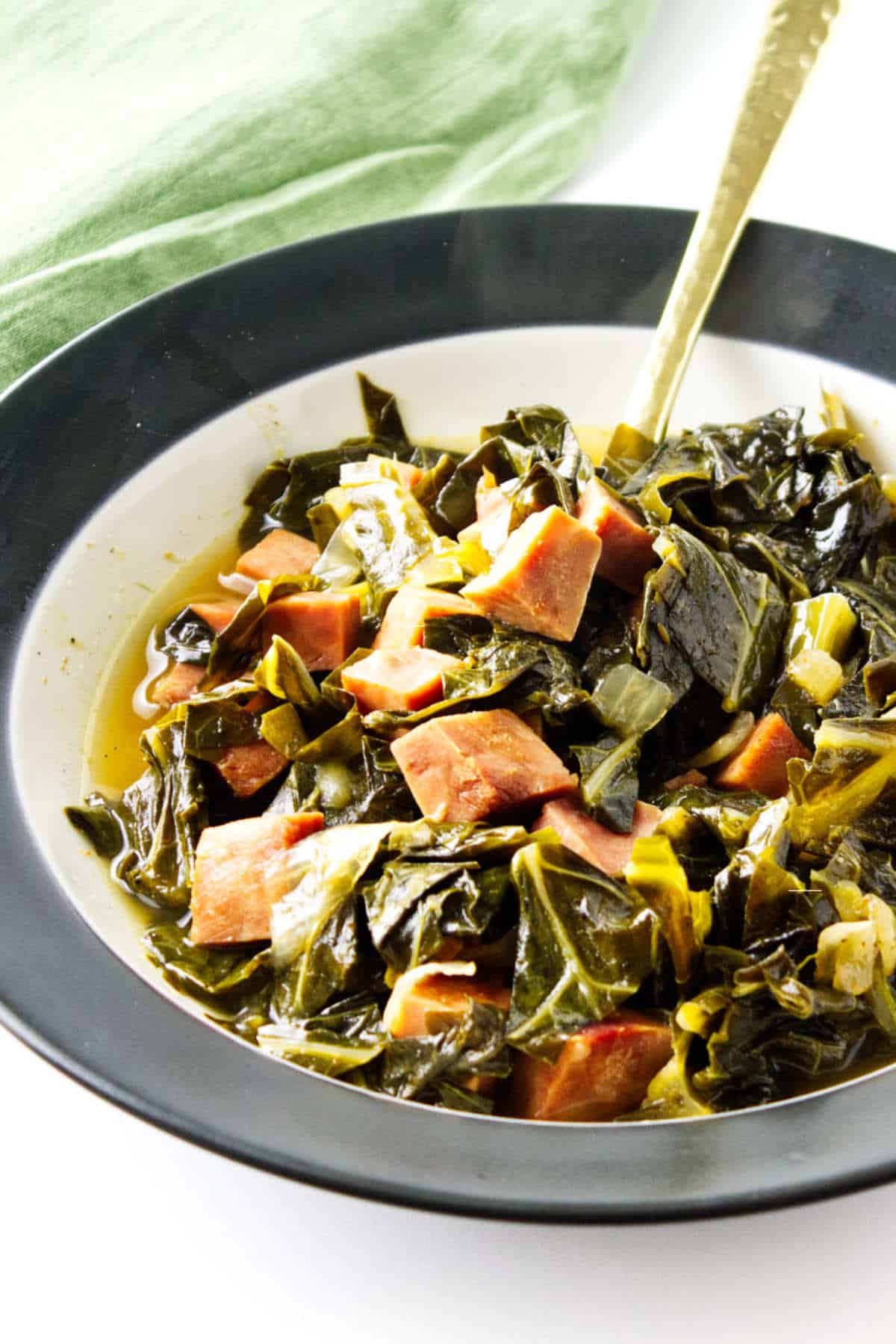 slow cooked ham and collards in a bowl. Perfect for Crocktober Fest.