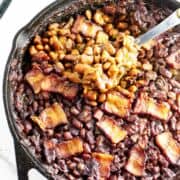 smoked baked beans in a cast iron skillet.