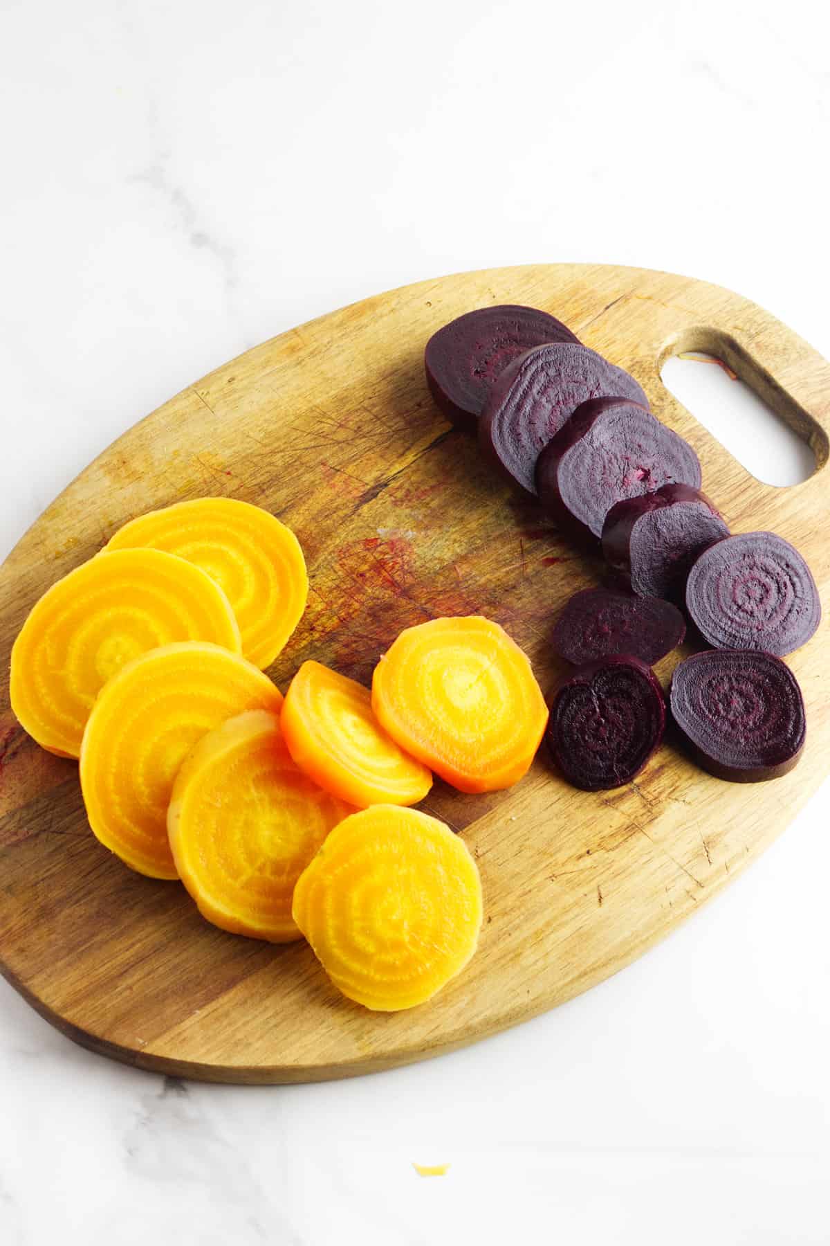 sliced beets on a cutting board.