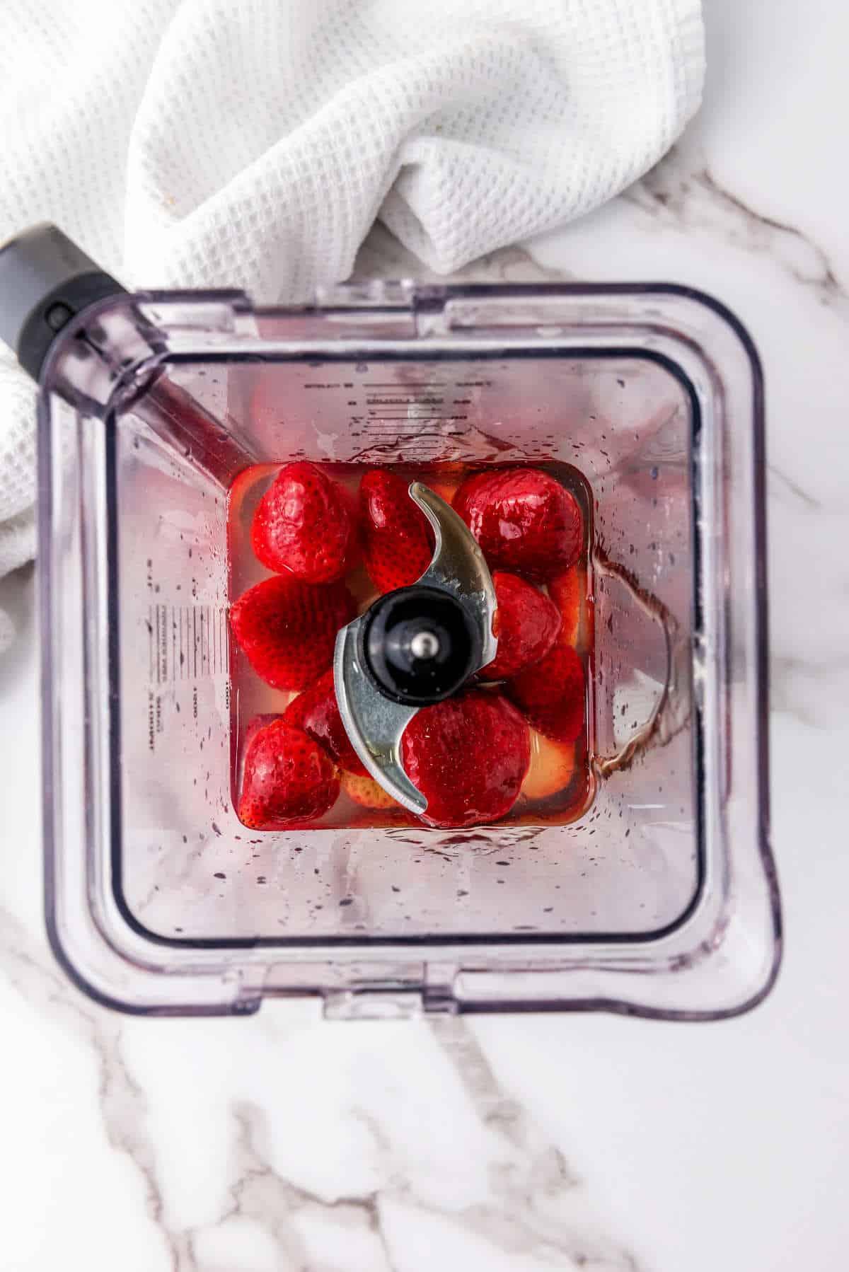 blender with berries inside.