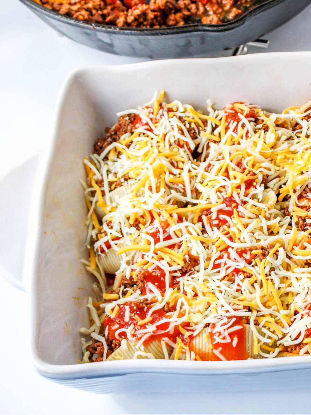 sauce and shredded cheese topped casserole.