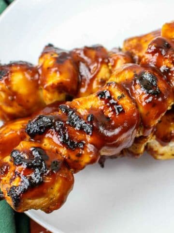 grilled chicken skewers on a plate.