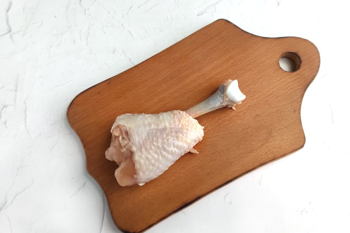 tissue and muscles removed from lower portion of a chicken leg.