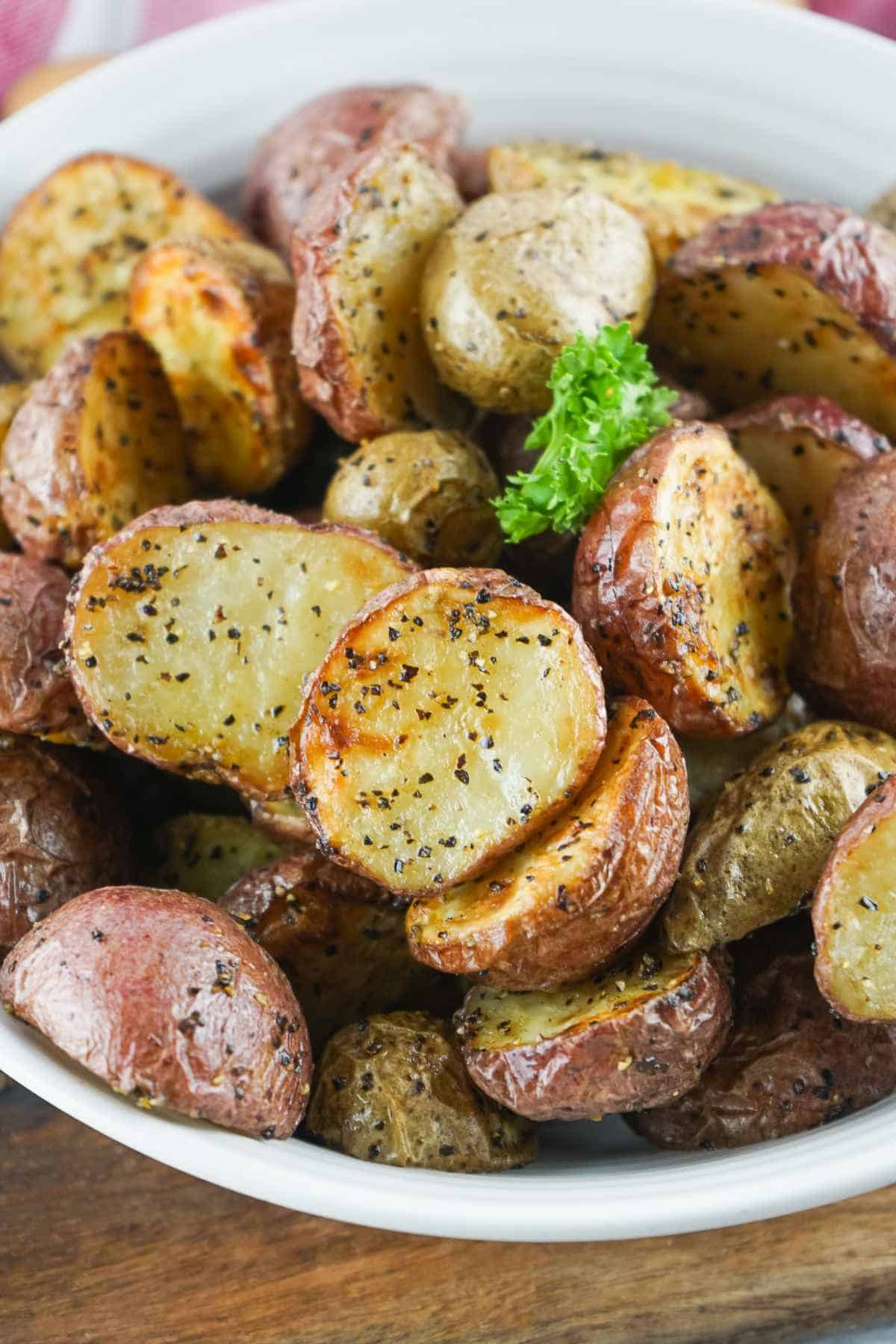 air fried red potatoes in a white bowl.